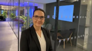 Patti in front of an office